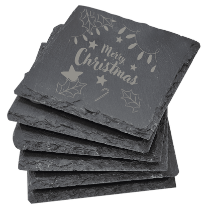 Set of slate coasters with 'Merry Christmas' engraving on a clear background