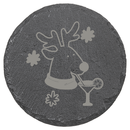 Round slate coaster with a reindeer design holding a cocktail on a clear background