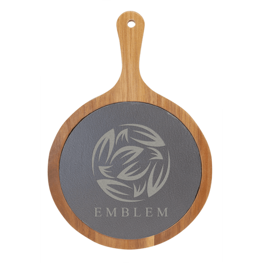 Wooden serving board with a dark slate circular surface featuring a design and the word 'EMBLEM'.