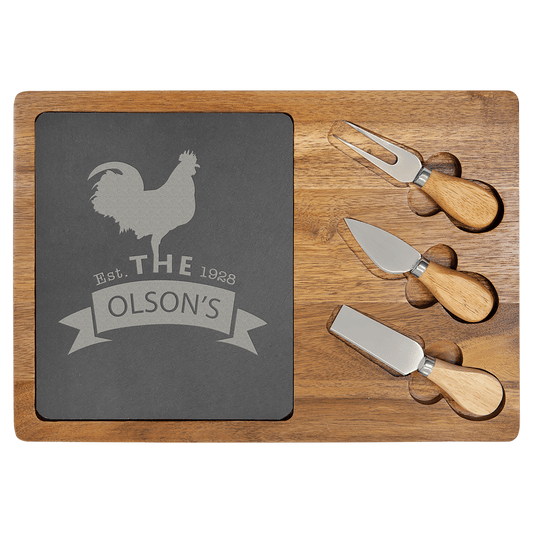 Wooden cutting board with slate insert and cheese knives on a clear background
