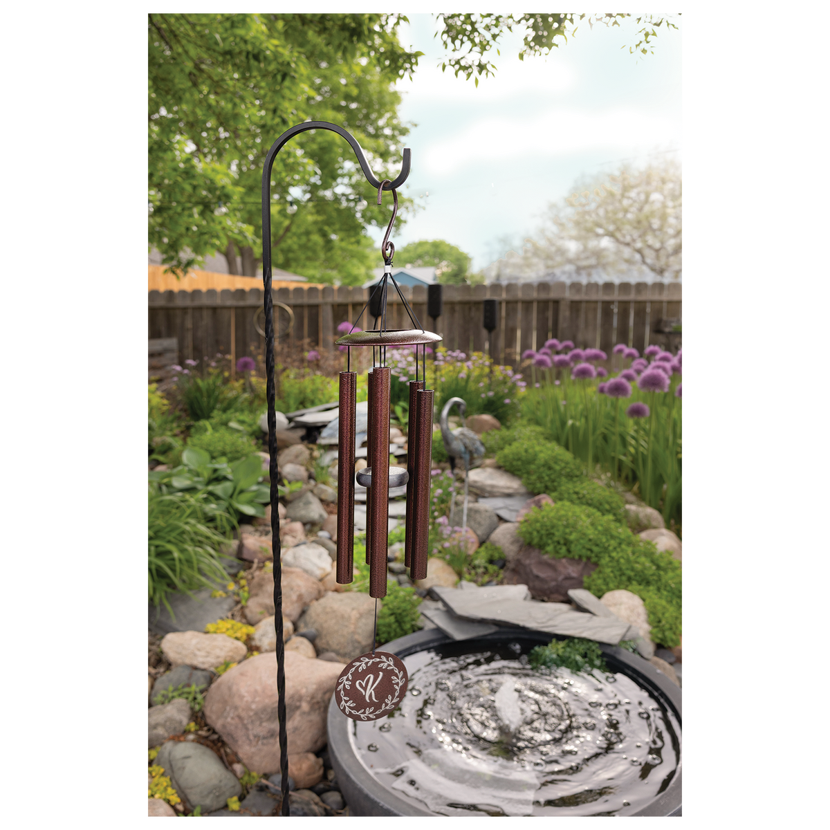 Engraved copper wind chime hanging outdoors