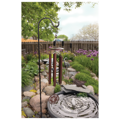 Engraved copper wind chime hanging outdoors