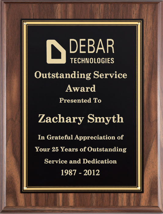 Walnut finish plaque with a black plate and gold border