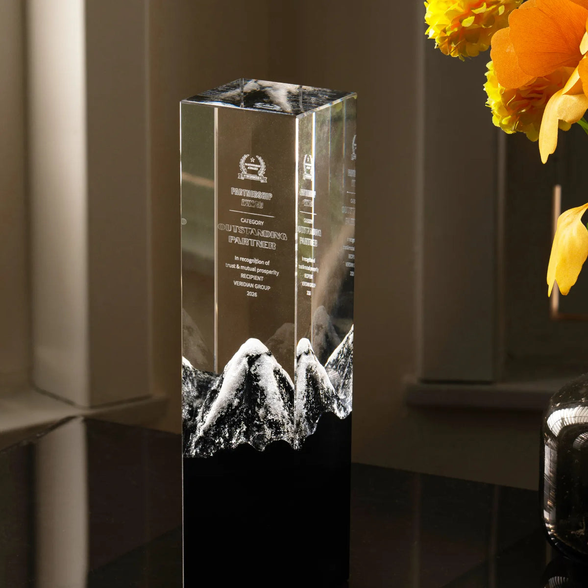 Snow mountain crystal award with a black and white marble base, front view