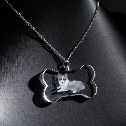 Clear bone-shaped crystal dog memorial necklace, close-up