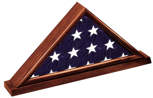 Dark cherry burial flag display case holding a folded 5' x 9.5' memorial casket flag on a matching cherry base