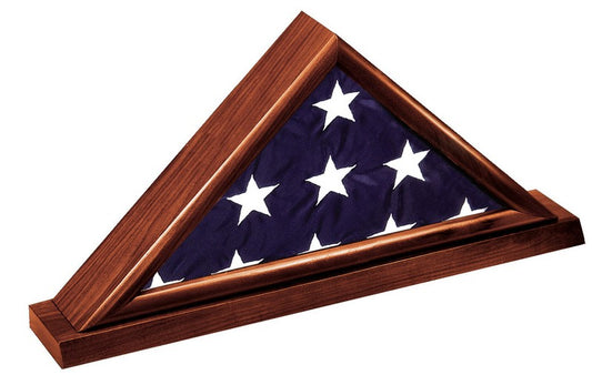Dark cherry flag display case holding a folded 3' x 5' American flag on a matching cherry base with room for an engraved plate