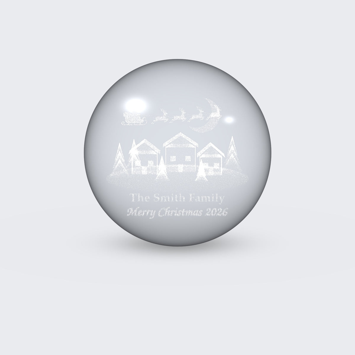 Christmas village scene engraved inside clear crystal ball
