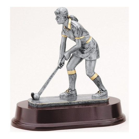 Female field hockey player resin trophy in antique silver with gold accents on a rosewood-finish base