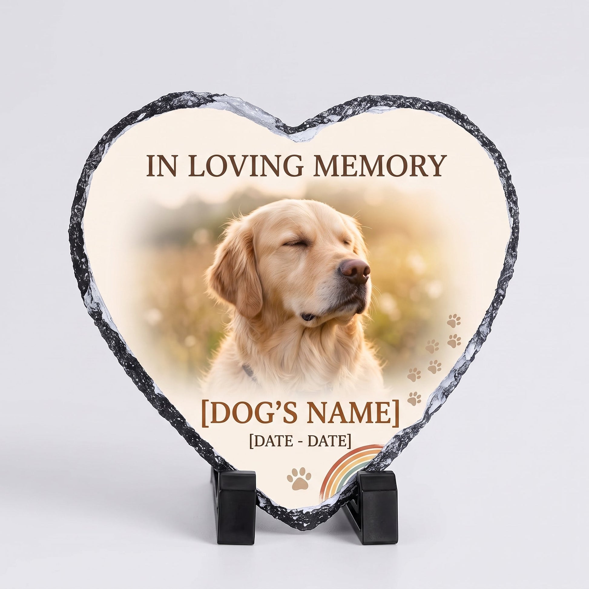Heart-shaped natural slate pet memorial photo stone on black display stands, printed in full color with a golden retriever photo, In Loving Memory, the pet's name and dates, paw prints and a rainbow