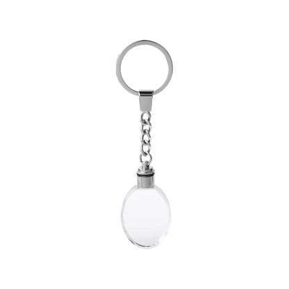 Light-up oval crystal keychain glowing with color-changing LED light