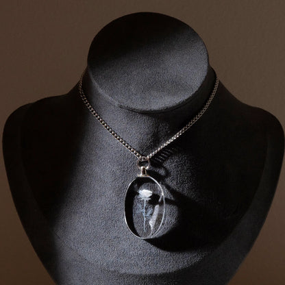 Clear oval crystal photo pendant necklace, close-up