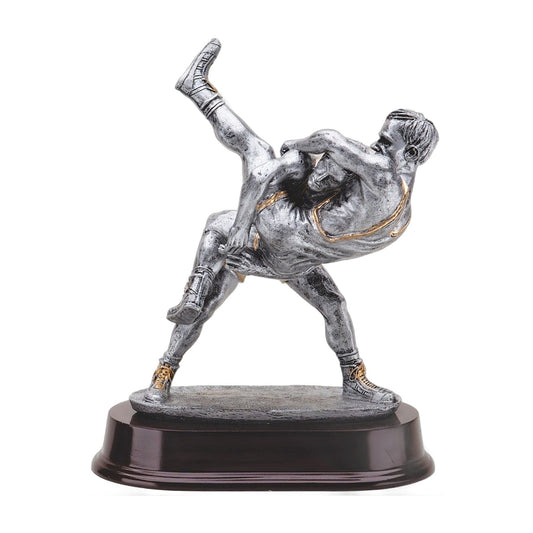 Pewter-finish double wrestler trophy showing a high-amplitude throw with gold trim on a dark wood-tone base