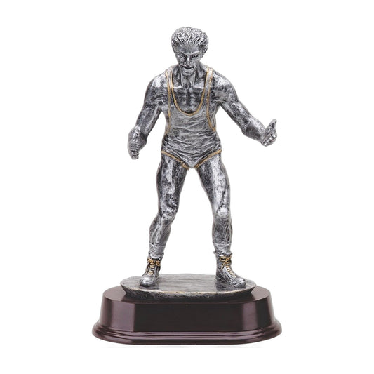 Pewter-finish wrestler trophy in ready stance with gold singlet trim on a dark wood-tone base