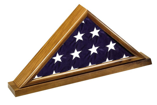 Solid walnut burial flag display case holding a folded 5' x 9.5' memorial casket flag on a matching walnut base